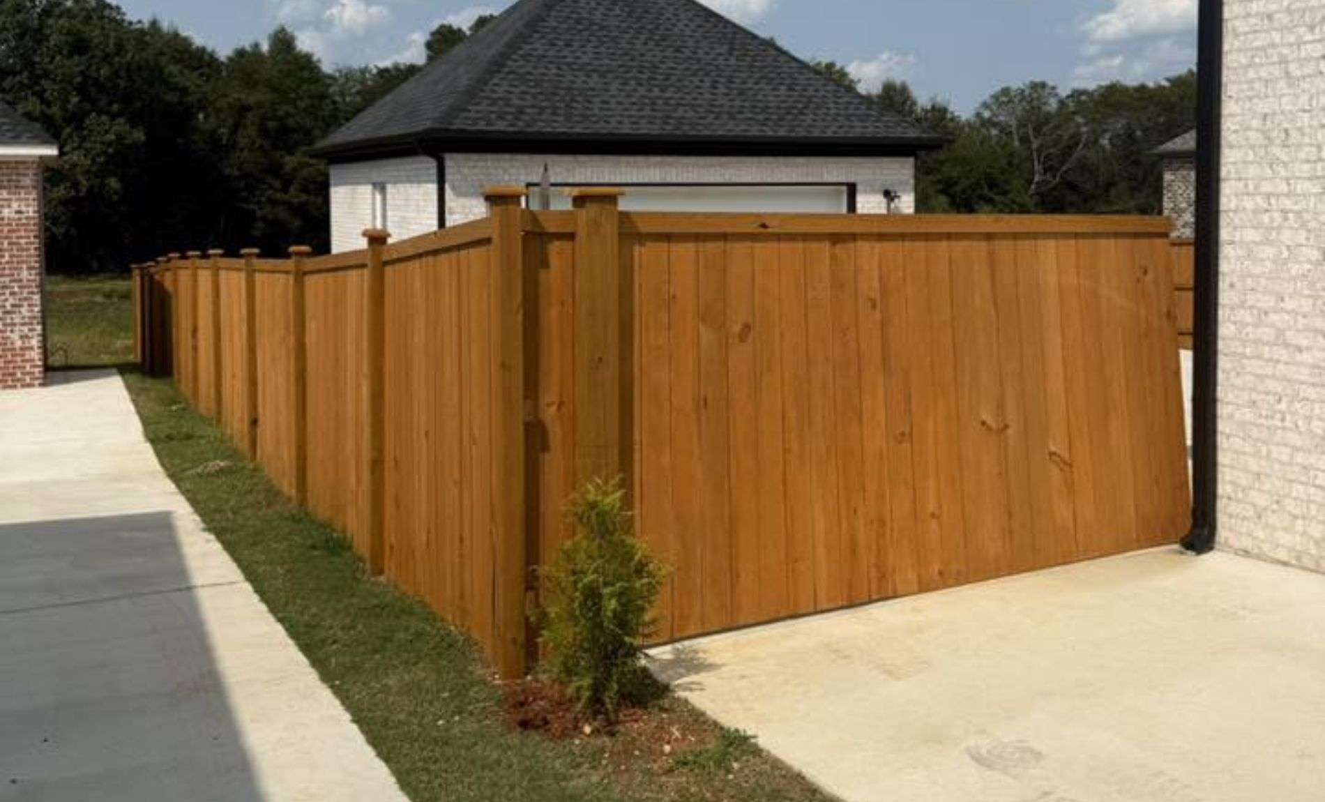 Wooden fence in a residential area, separating properties and yard spaces