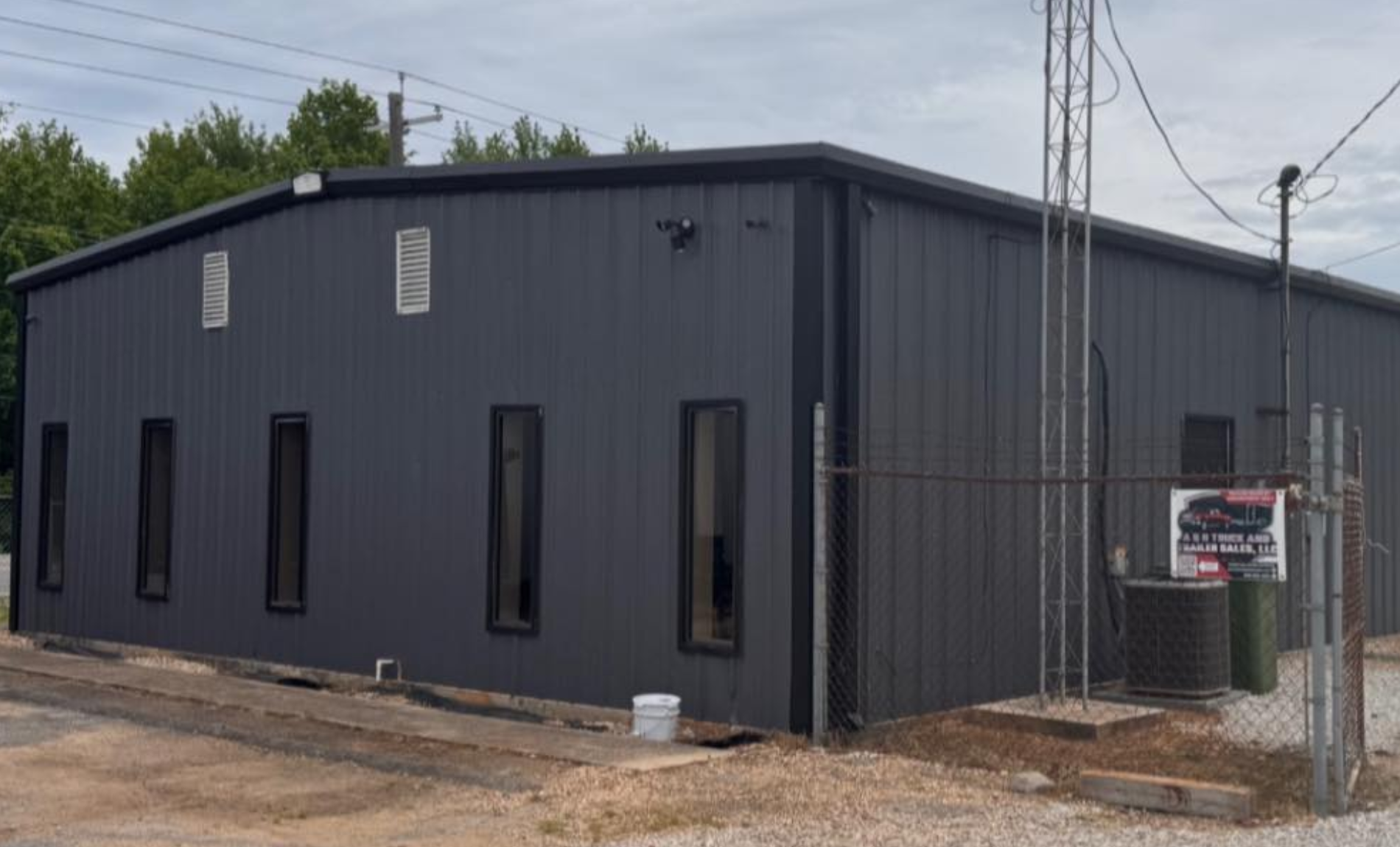 warehouse with gray siding, view from the front exterior